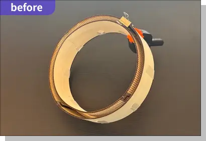 円形のウォールシェルフの側面-
              外側をクランプで止めている写真