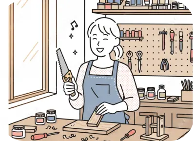 モノづくりが「小ビジネス」へと成長していく姿をイメージしたイラスト。充実した設備が整うアトリエで、女性が楽しそうに木材の加工や仕上げに取り組んでいます。安定した注文に応えながら、より本格的な制作環境で効率よく作業を進める、一歩進んだモノづくりの日常を描いています。
